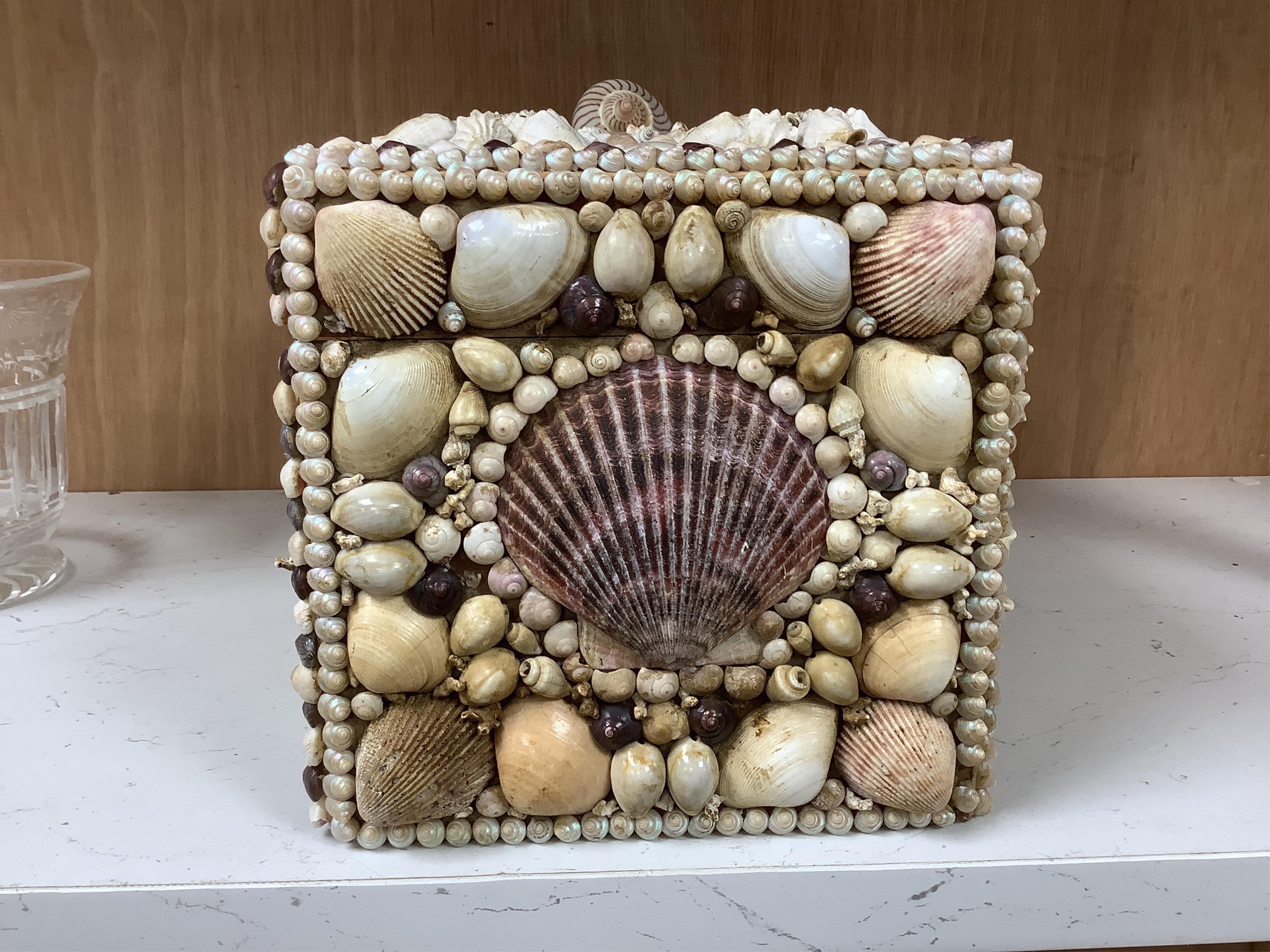 A George III tea caddy, shell covered in 19th century. 32cm wide x 15cm high x 17cm deep. Condition - a few shells missing but appears in good condition